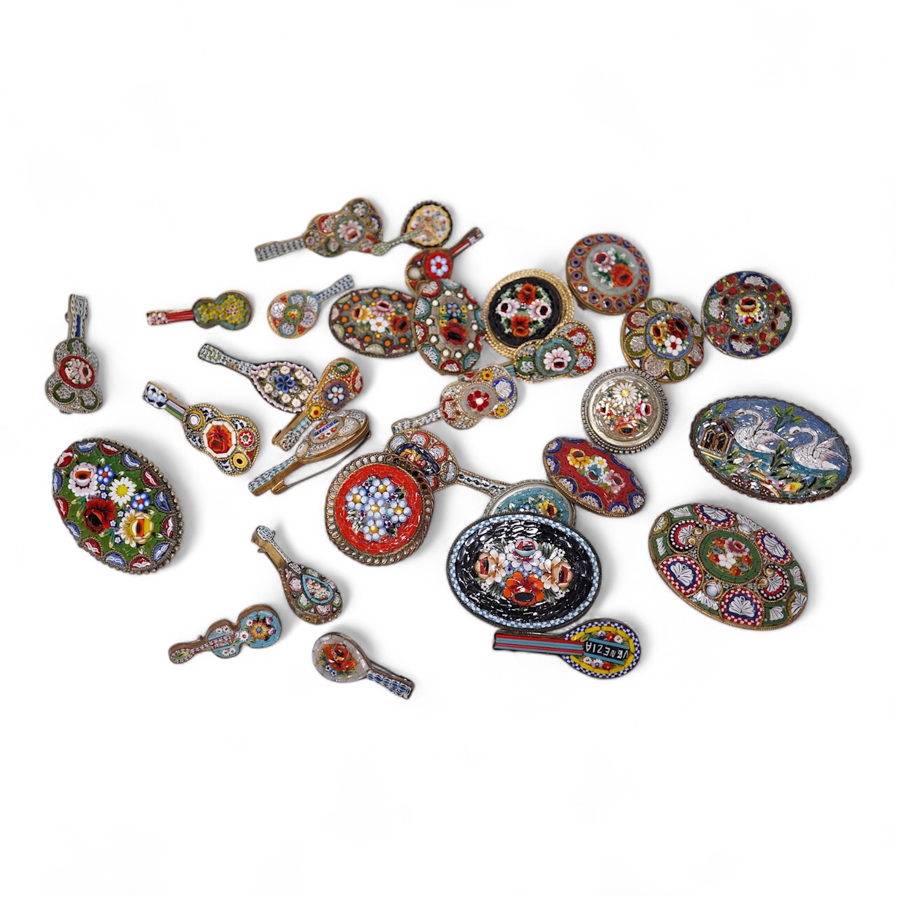 Thirty-one costume micro-mosaic brooches, to include seventeen guitar and banjo shaped brooches, five large oval/ circular brooches including scenic swan brooch, eight, smaller brooches and a pendant. Condition - fair/go